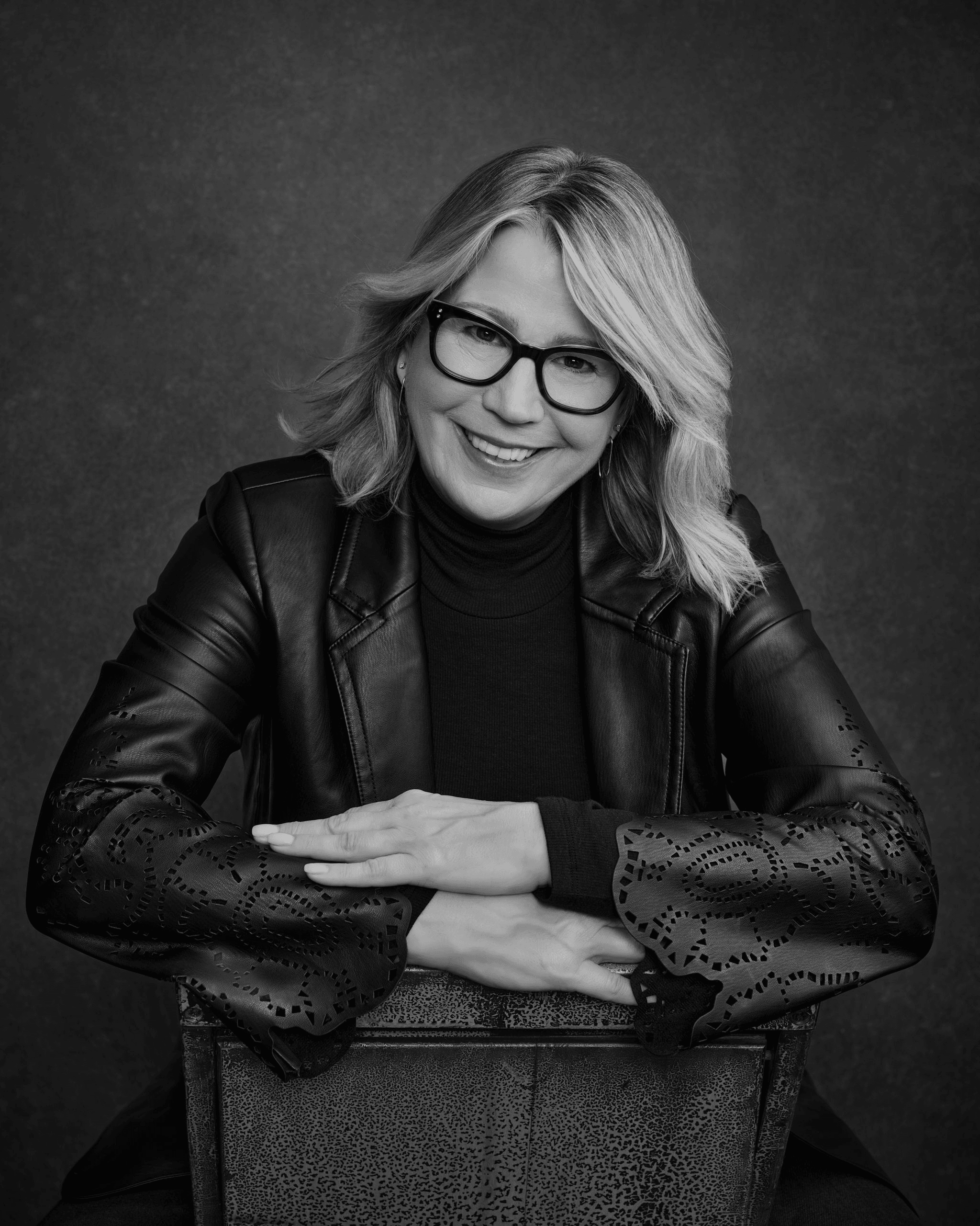Jo Carkner portrait in leather jacket with glasses